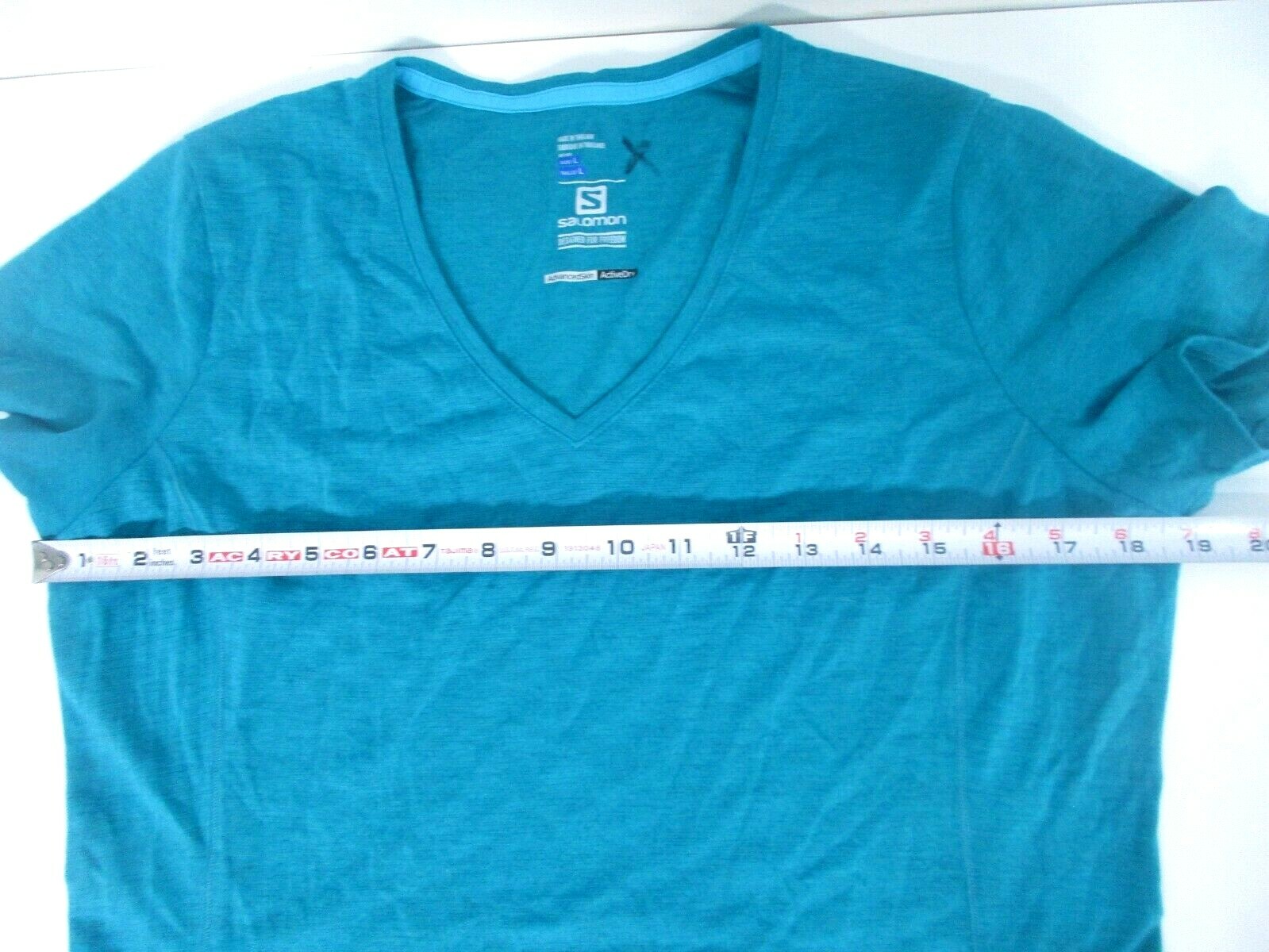 T shirt Salomon donna taglia LG V collo abbigliamento sportivo magliette turchesi tasca posteriore lato