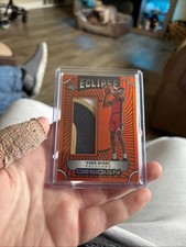 2024-25 Panini Obsidian -Eclipse Materials Yves Missi, eclipse  Orange Flood /99