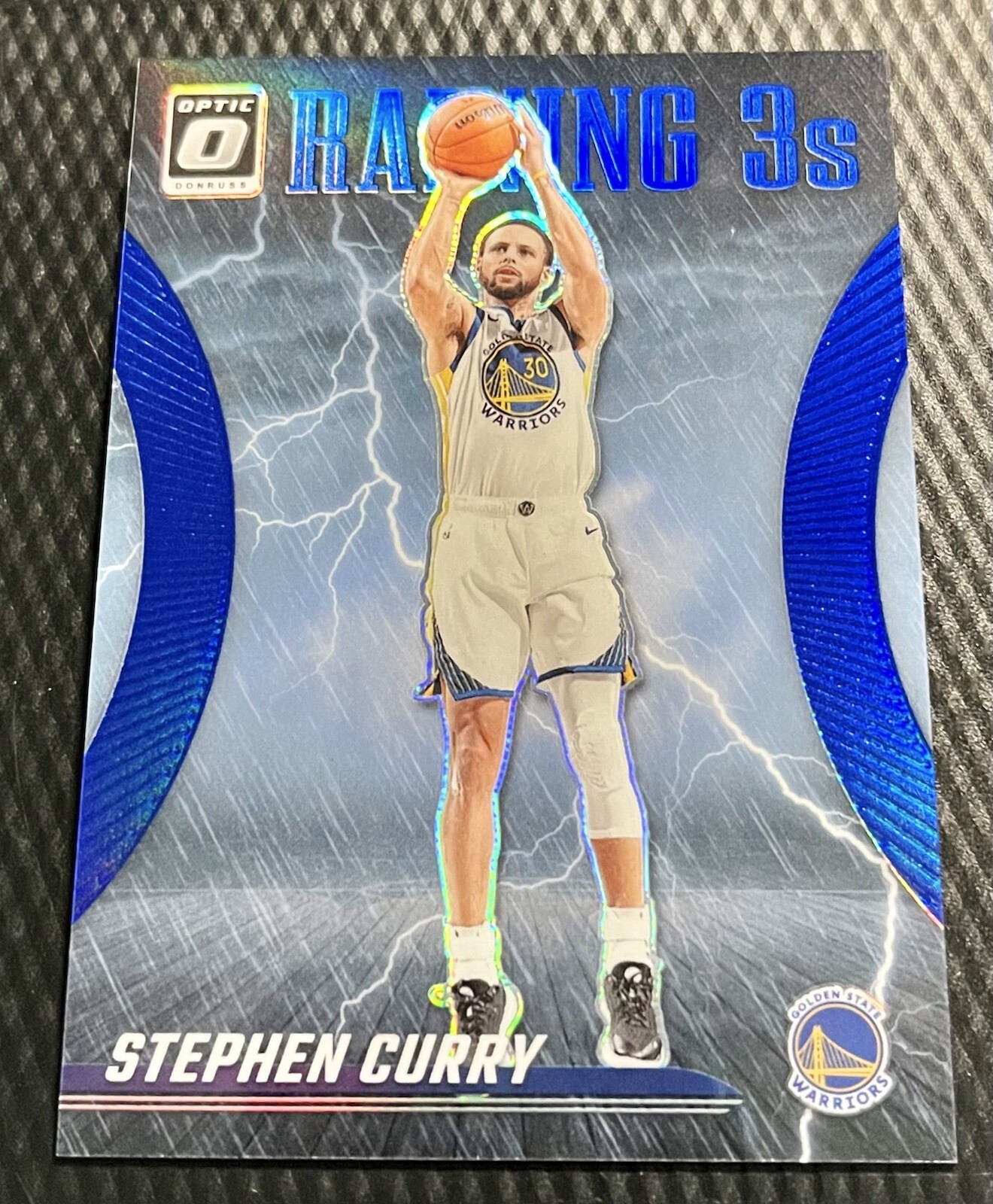 2023 Stephen Curry Warriors 7/49 Panini Donruss Optic Raining 3s Blue Prizm #9