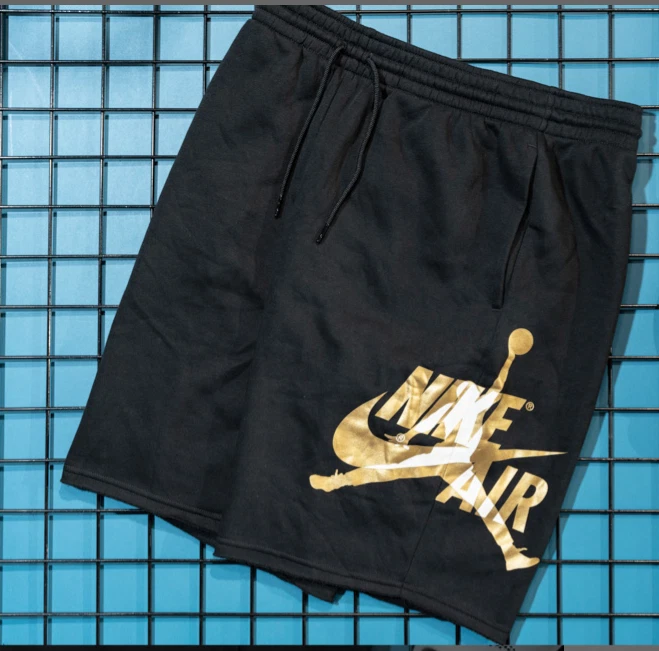 Jordan black and gold best sale shorts