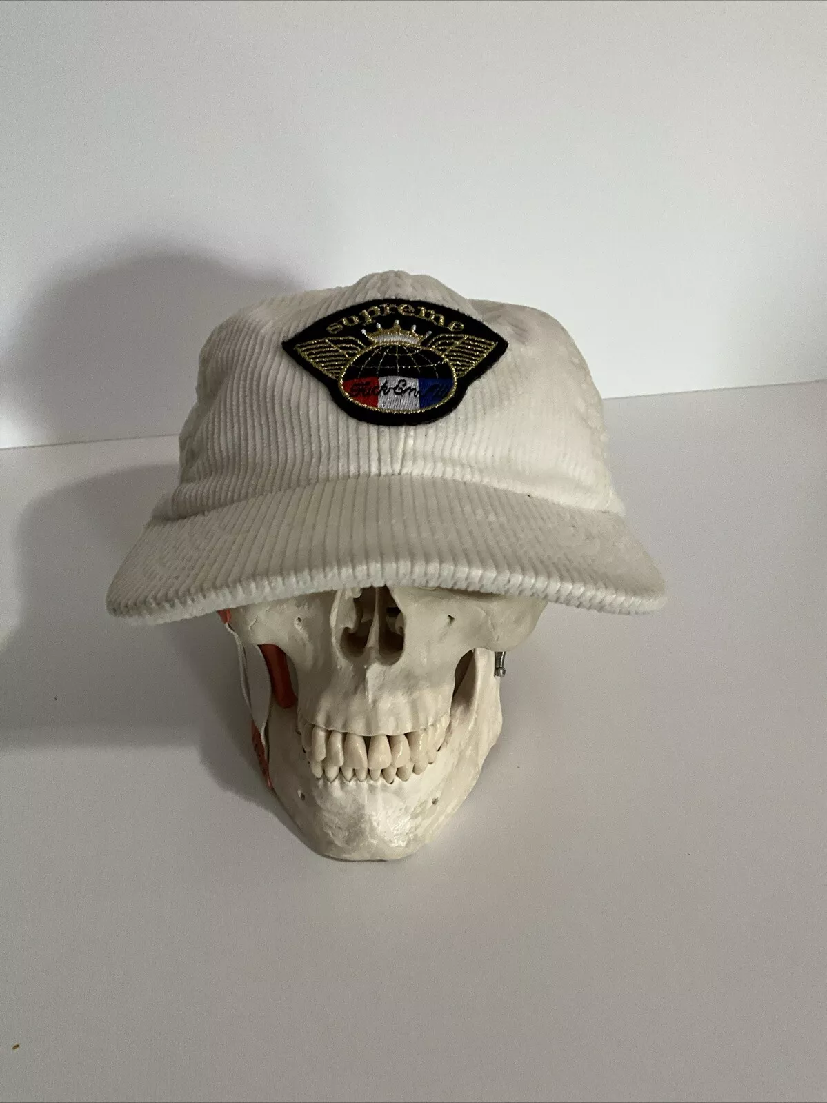 Chapeau Supreme velours côtelé 6 panneaux ivoire Fuc ‘Em All