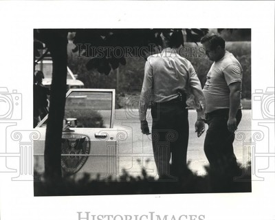 #ad 1982 Press Photo John M. Buchler with Police Deputy in Metairie Louisiana $24.99