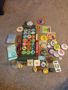 Boy Scouts Lot tie slides Knives Pins Etc plus Sash With Badges 50 Pieces