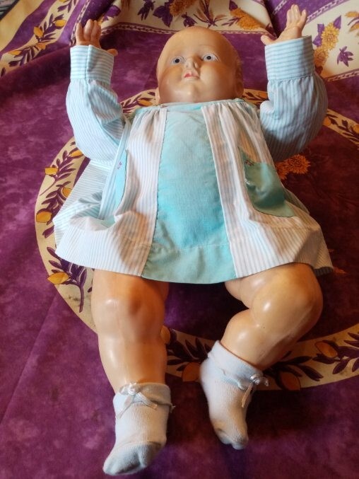 Ancienne poupée tamponné d'une tête d'aigle France 50