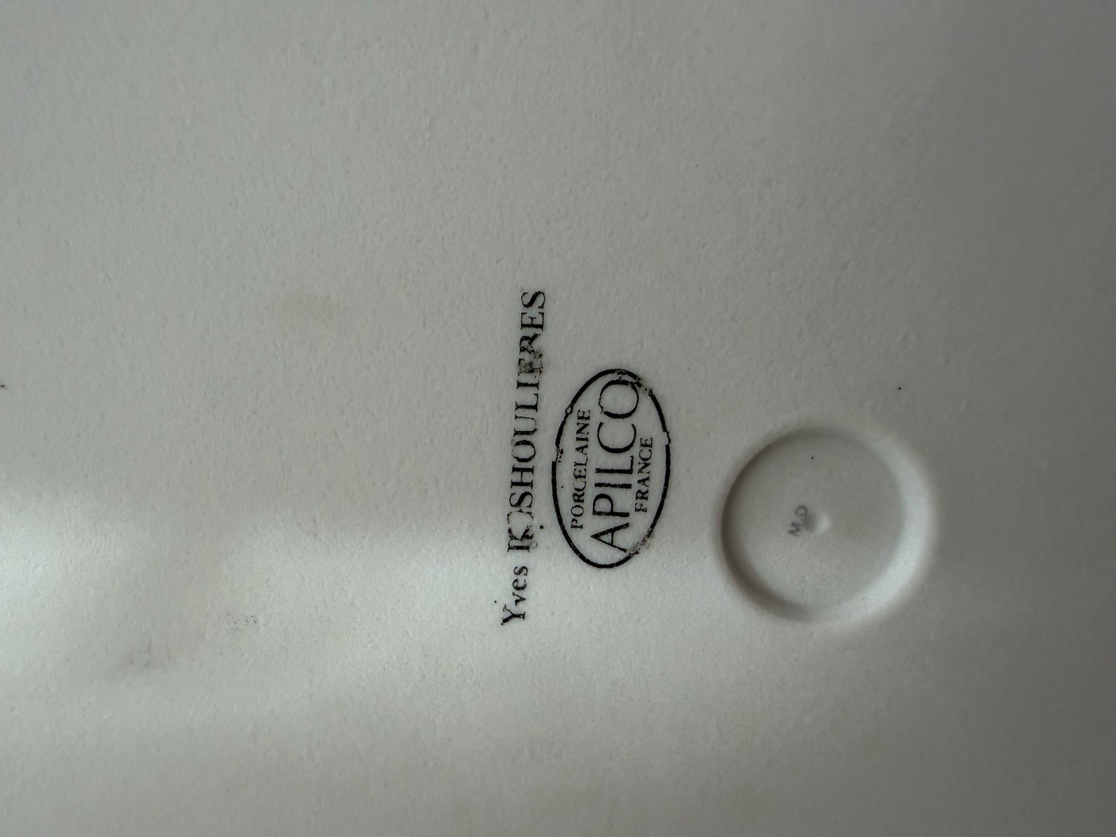 Philippe Deshoulieres Apilco porcelain plate with a fruit design. 11 7/8"