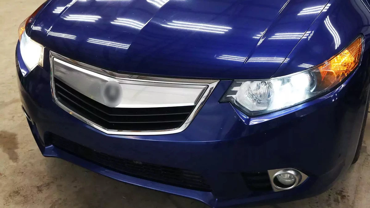 Wagon with a faulty high beam headlight that needs to be replaced.