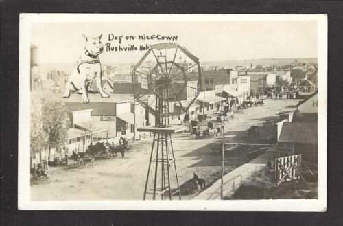 Rushville Nebraska NE 1910 RPPC Wooden Windmill, Main Street, GIANT DOG on Roof