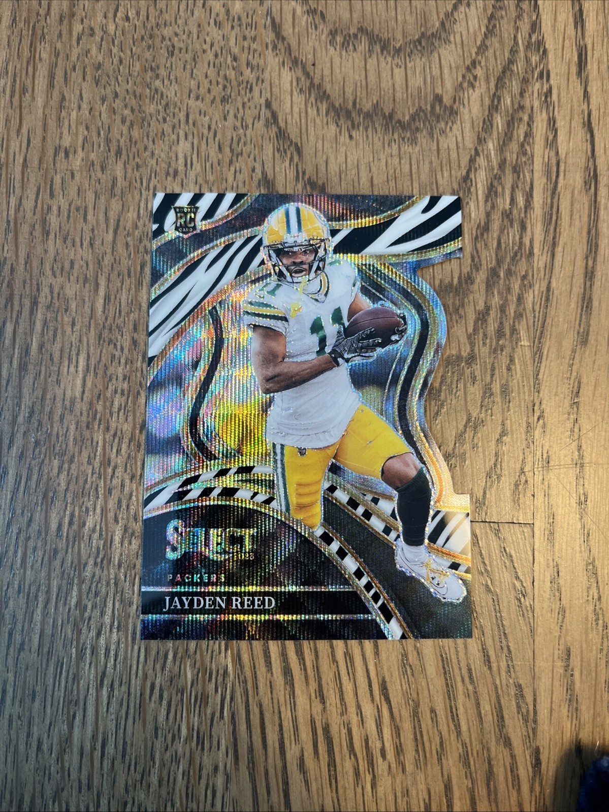 2023 Panini Select - Club Level Jayden Reed #258 Zebra Prizm Die-Cut (RC) SP GM