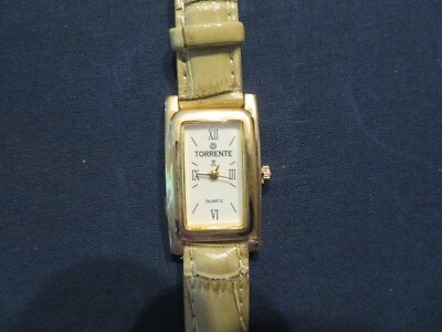 Montre Bracelet Femme Torrente - Cadran Blanc Chiffres Romains, Boîtier Doré, Bracelet Beige - NEUVE