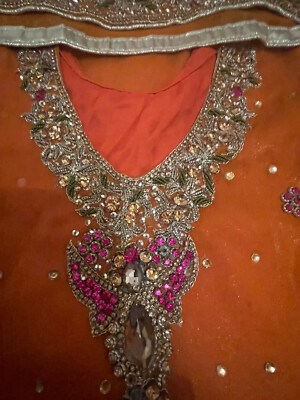 orange mehndi dress pakistani A Perfect bright orange mehndi dress adorned with multi coloured hand work and mirror work for upcoming mehndi brides. , Can be customised , For orders inbox us , Makeup @glambyaneela , Jewellery