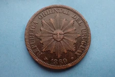 Uruguay, 4 Centesimos 1869 H, as shown.