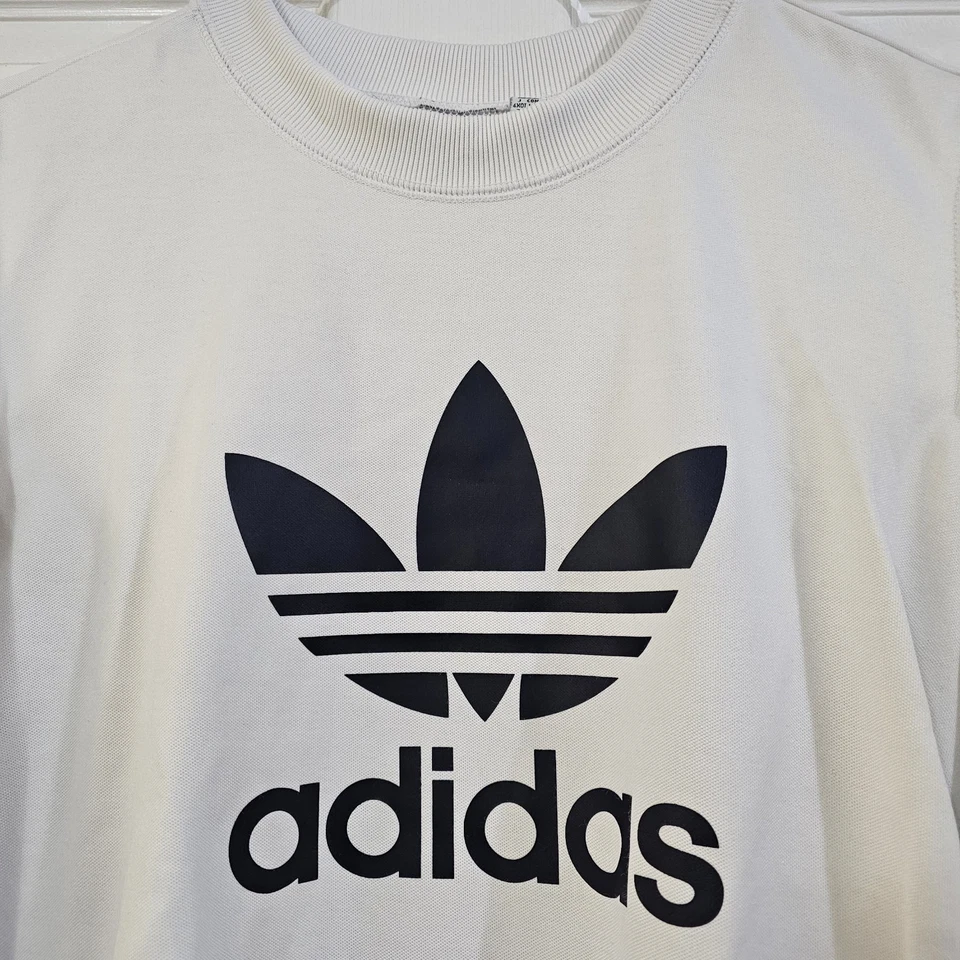 Sudadera para mujer Adidas con cuello redondo recortada al hombro frío blanca talla L Foto 3 de 4