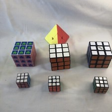 Lote de 7 Rompecabezas y Rompecabezas Triangulares Cubo Rubiks 3x3 Regular y Mini Educar