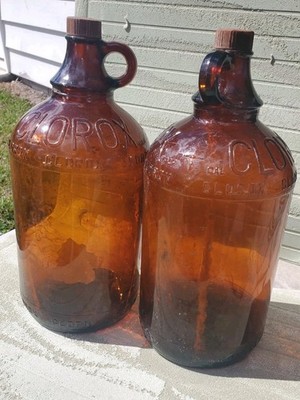 (2) Vintage Clorox Half Gallon, 64 oz, Embossed Brown Glass Jug, With Lids
