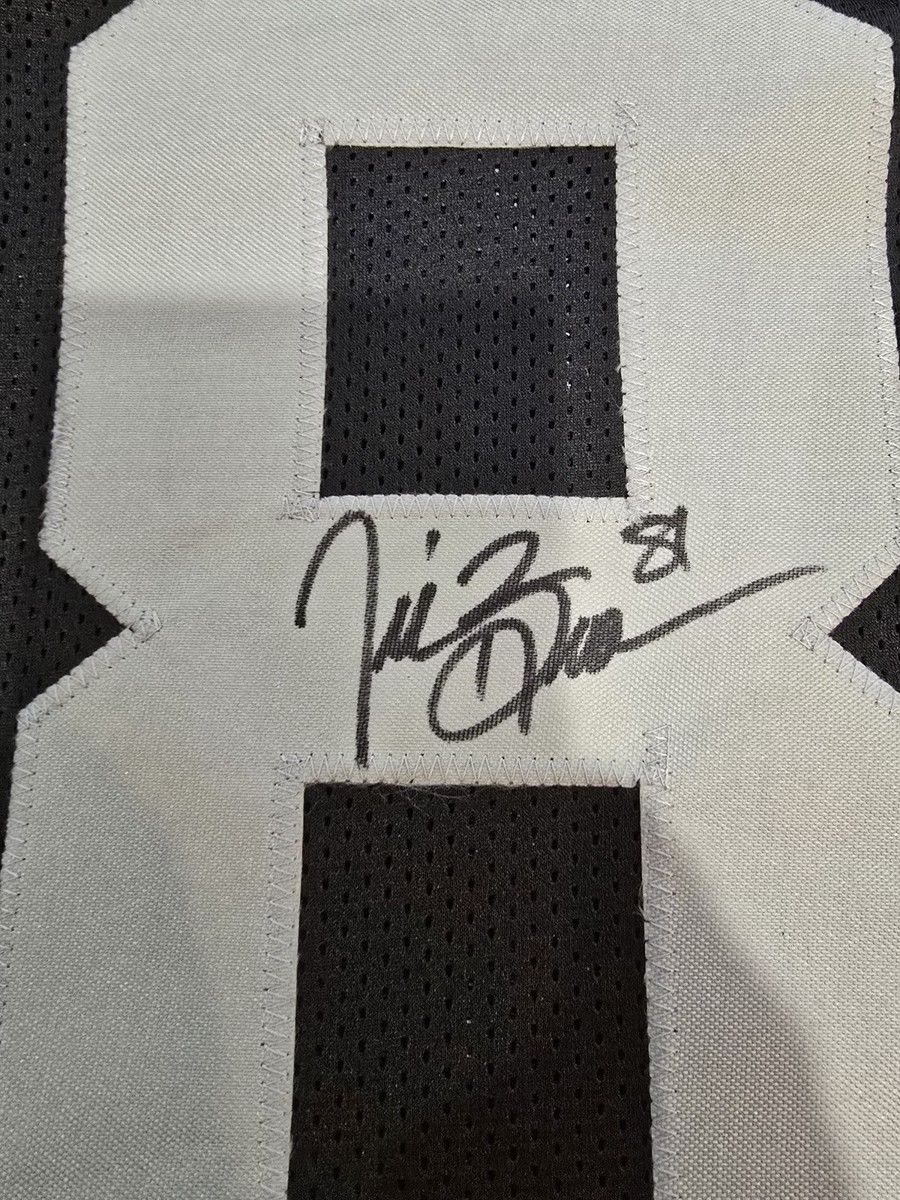 Tim Brown Signed Football Jersey - Player Authentication. Heisman