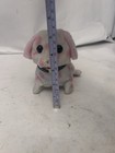 white with pink polka dot yipping puppy toy broken bag leg made in China — photo 3