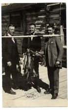 RPPC men fish fishing log cabin SIGNED back side boxer? GENE TUNNEY 1908-24