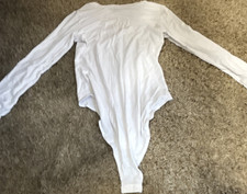 White Long Sleeve One Piece Solid Women's Bodysuit with Snap Closure