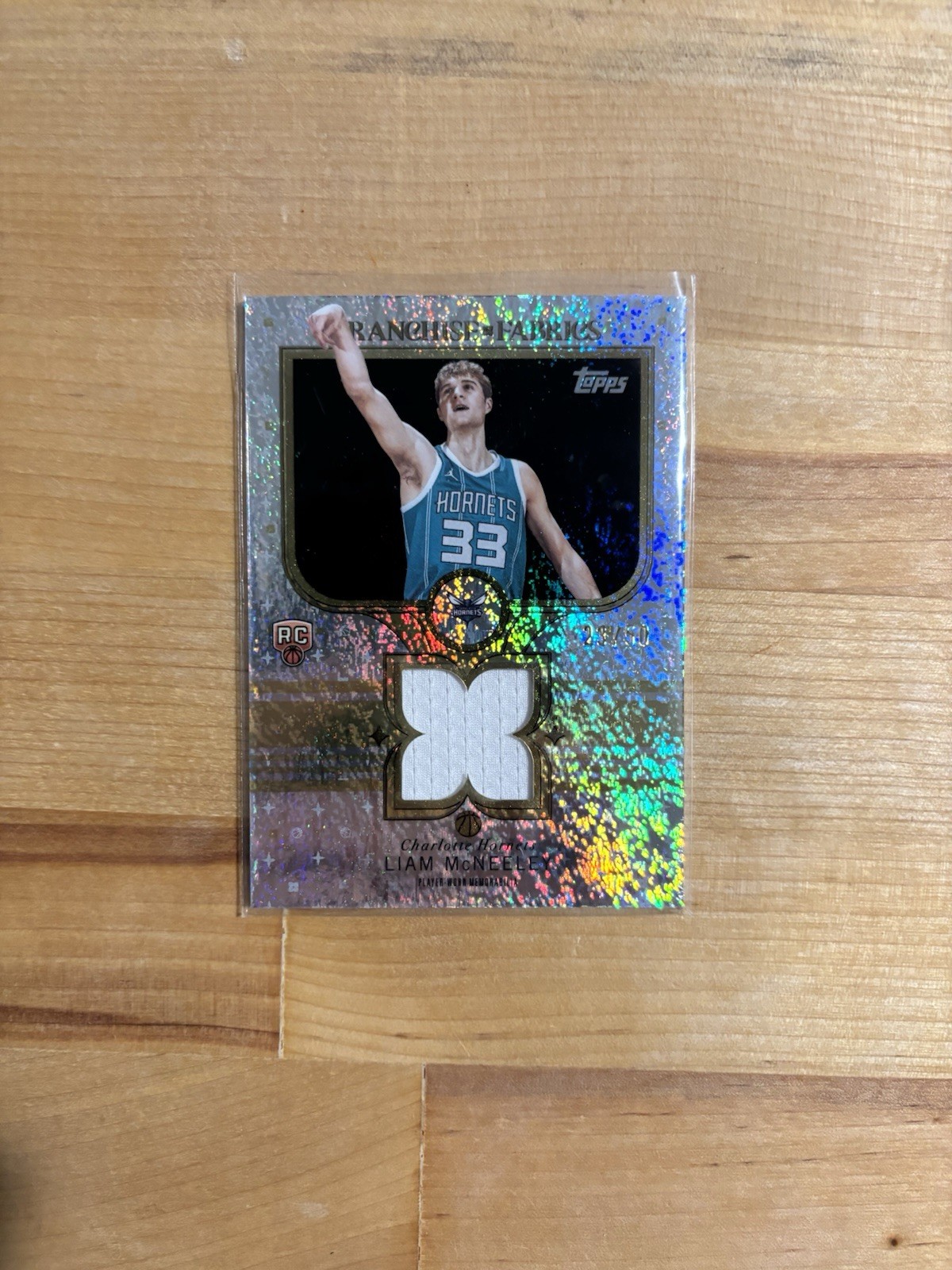 2025-26 Topps Liam McNeeley Rookie Franchise Fabrics #/50 Gold Glitter