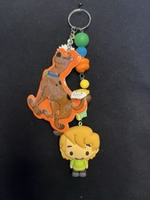 1979 Vintage Scooby Doo and Gang Bag Charm-Key Chain paired with Modern Shaggy