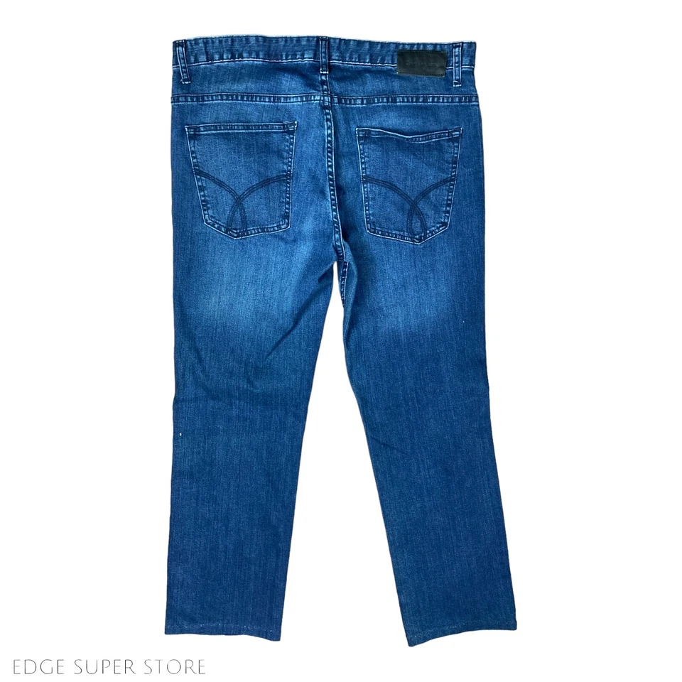 Pantalones de mezclilla desgastados elásticos lavado azul pierna recta Calvin Klein talla 36 X 31 Foto 4 de 4