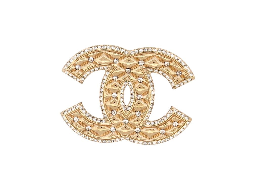 Broche Chanel CC en métal doré matelassé et strass éclatants pour femme