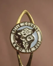 COLLECTIBLE CATTLE COUNTRY R.M. OF STE. ROSE MB. BULL GRAPHIC GOLD TONE SP-1647