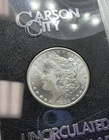 1883 CC MORGAN SILVER DOLLAR GSA BOX AND COA, HIGHER GRADE