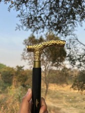 Elegant Black Walking Cane with Ornate Golden Handle A Classic Blend of Style
