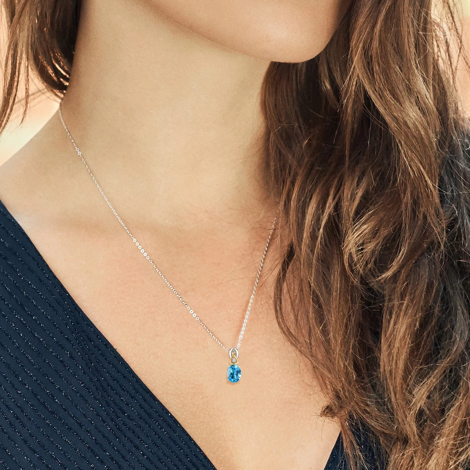 Juego de pendientes colgantes de topacio azul suizo de plata 925 y oro amarillo de 10 quilates para mujer Foto 3 de 3