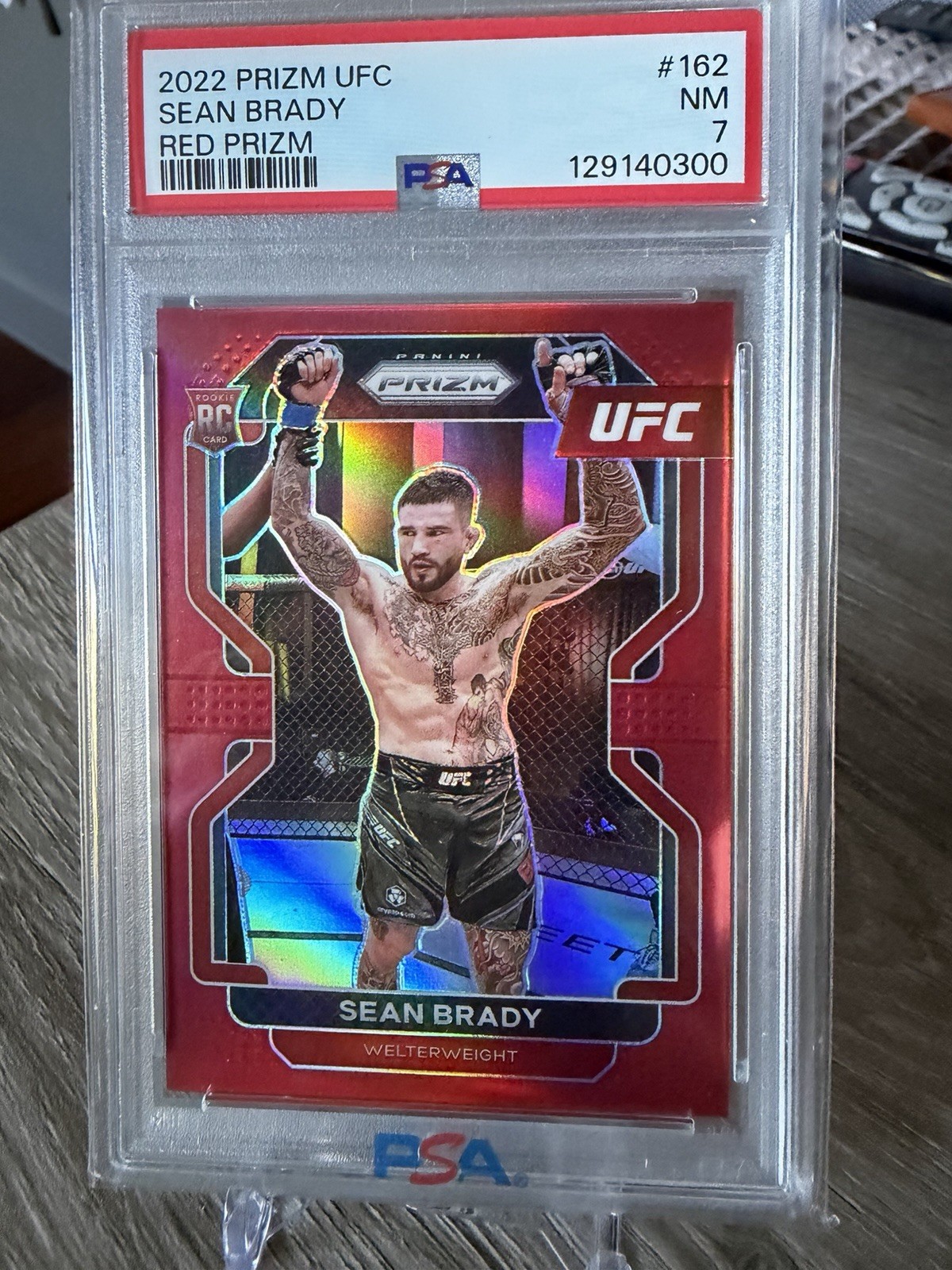 2022 Panini Prizm UFC - Sean Brady #162 Red Prizm /299 (RC) PSA 7 Graded NM