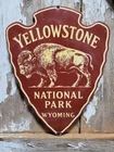 VINTAGE YELLOWSTONE PORCELAIN SIGN OLD NATIONAL PARK WYOMING BISON ARROWHEAD 12"