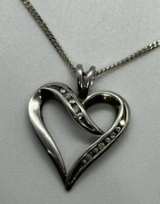 Sterling silver and genuine diamond heart pendant with chain necklace