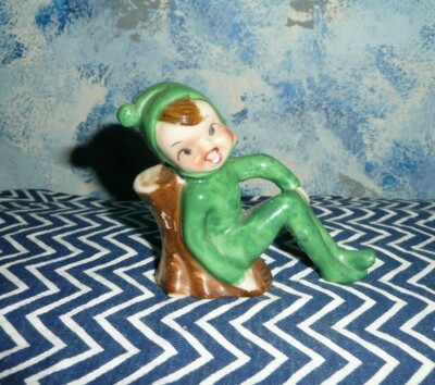Vintage Laughing  cross-eyed Pixie Elf  leaned on a Trunk, Cute!