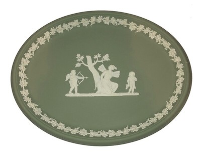 probably Wedgwood Small round green china plate with antique decor of a woman with angel