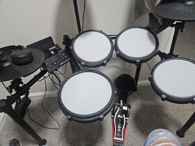alesis nitro with all its hi hat crash and ride accessories. dw 5000 pedal 