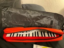 Red melodica instrument all parts not used