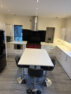 Howdens High Gloss White Kitchen With Island And American Fridge Surround