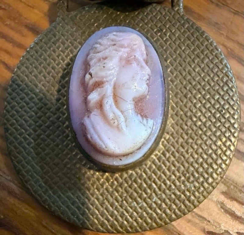 Watch fob: Cameo on brass, hangs off leather chain. VINTAGE! (Lot #319)