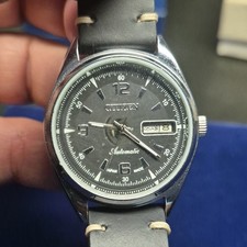 Vtg 1980's CitizenAutomatic Men’s Day/Date w/ Arabic script wheel at 3 o'clock. 