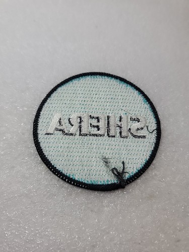 SHERA Embroidered Logo Patch Emblem Fabric Concrete Building Round Sew On Coat - Picture 3 of 8