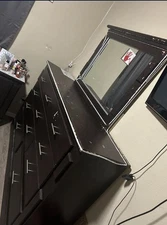 black dresser with silver sterling handles with big mirror