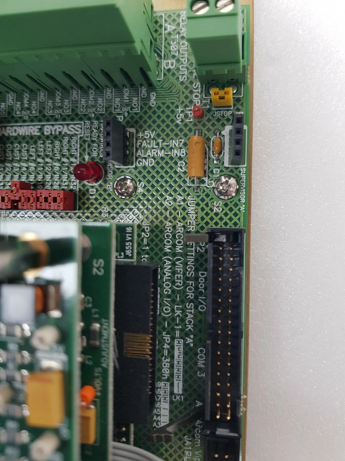 Hardwire bypass, supervisor and Door I/O connector area of the AP14295 board