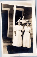 RPPC: Women's portrait: Three women in white and checkered dresses