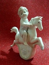 statuina PORCELLANA  MILEDI BAMBINO CAVALLINO A DONDOLO PUTTO VINTAGE FIRMATO