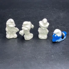 Vintage Smurfs Mini Ceramic Bisque Figurines Lot Of 4. 1 Painted.