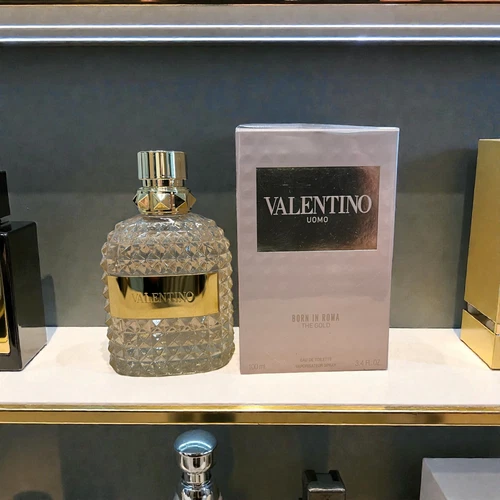 Valentino Uomo Born In Roma The Gold 3.4oz Eau De Toilette bottle with crystal-like design and gold lettering on black box.