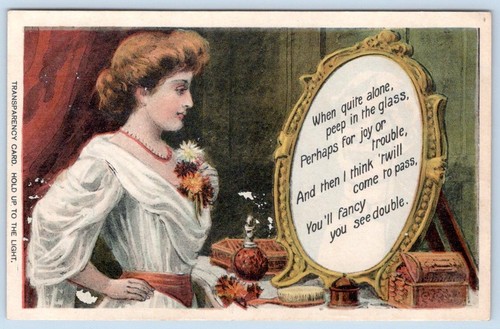 1914 HOLD TO THE LIGHT HTL WOMAN MIRROR MERRY CHRISTMAS GREETINGS POSTCARD - Picture 2 of 3