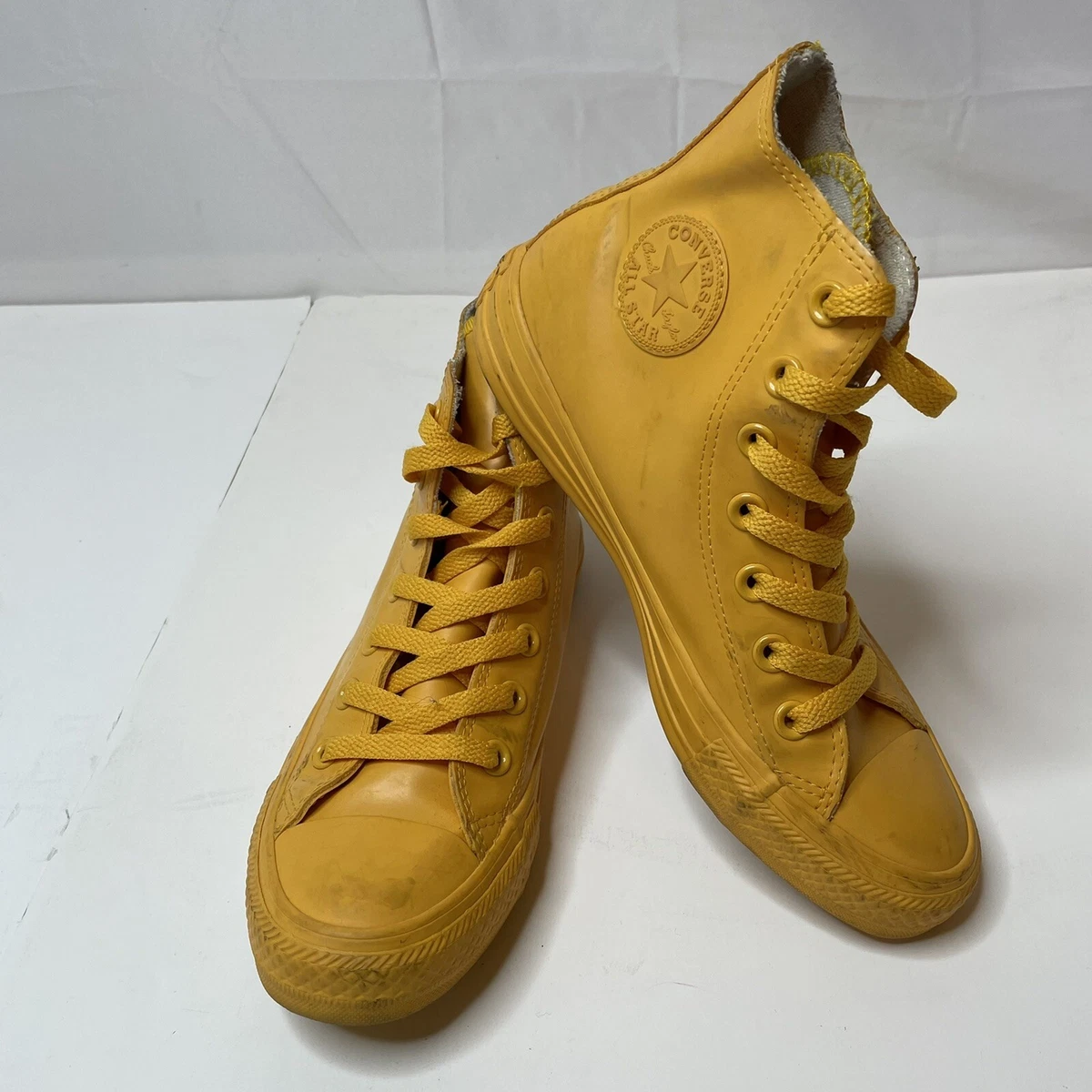 Yellow high top store tennis shoes