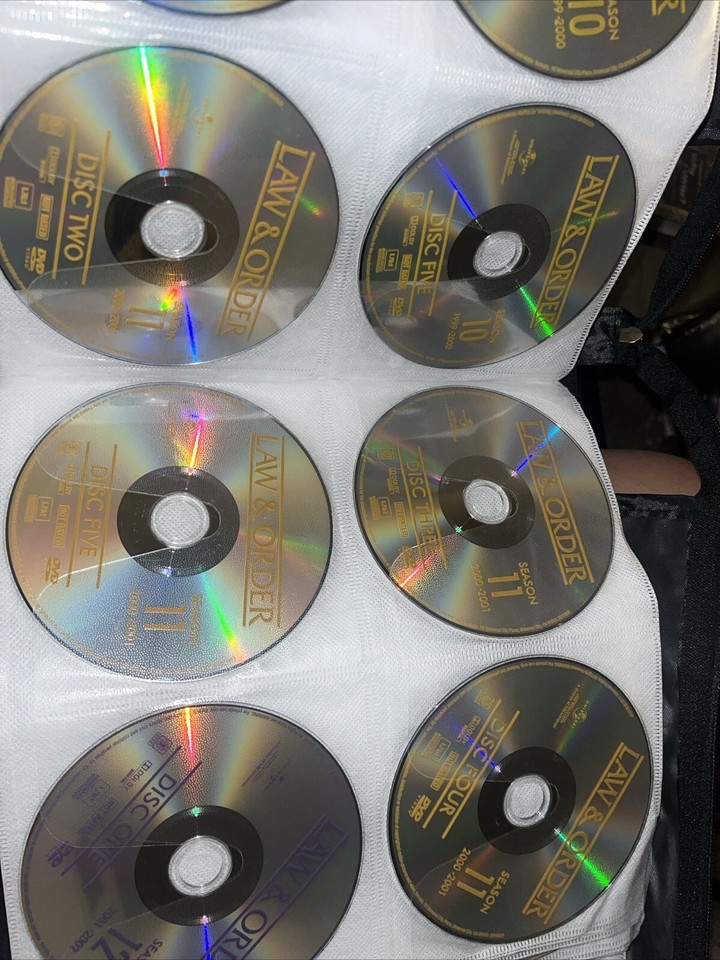 Binder of DVDs Classic TV shows and Crime Law & Order, The Equalizer